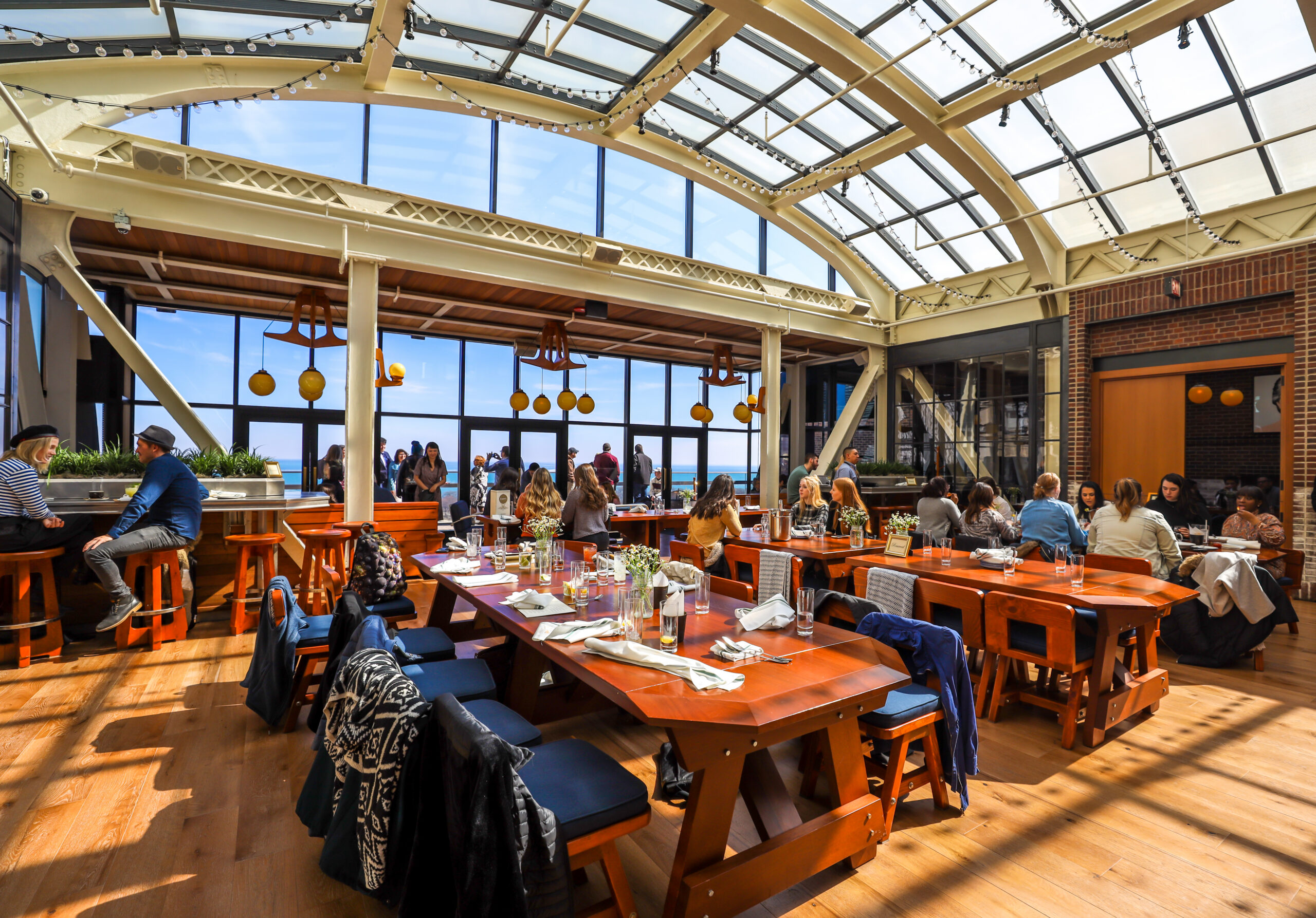 A vibrant Chicago restaurant interior during Restaurant Week, featuring diners enjoying multi-course meals in a modern urban setting.