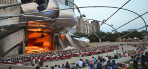 Outdoor concert at Jay Pritzker Pavilion in Millennium Park, showcasing one of the best Chicago summer activities for music, culture, and entertainment.