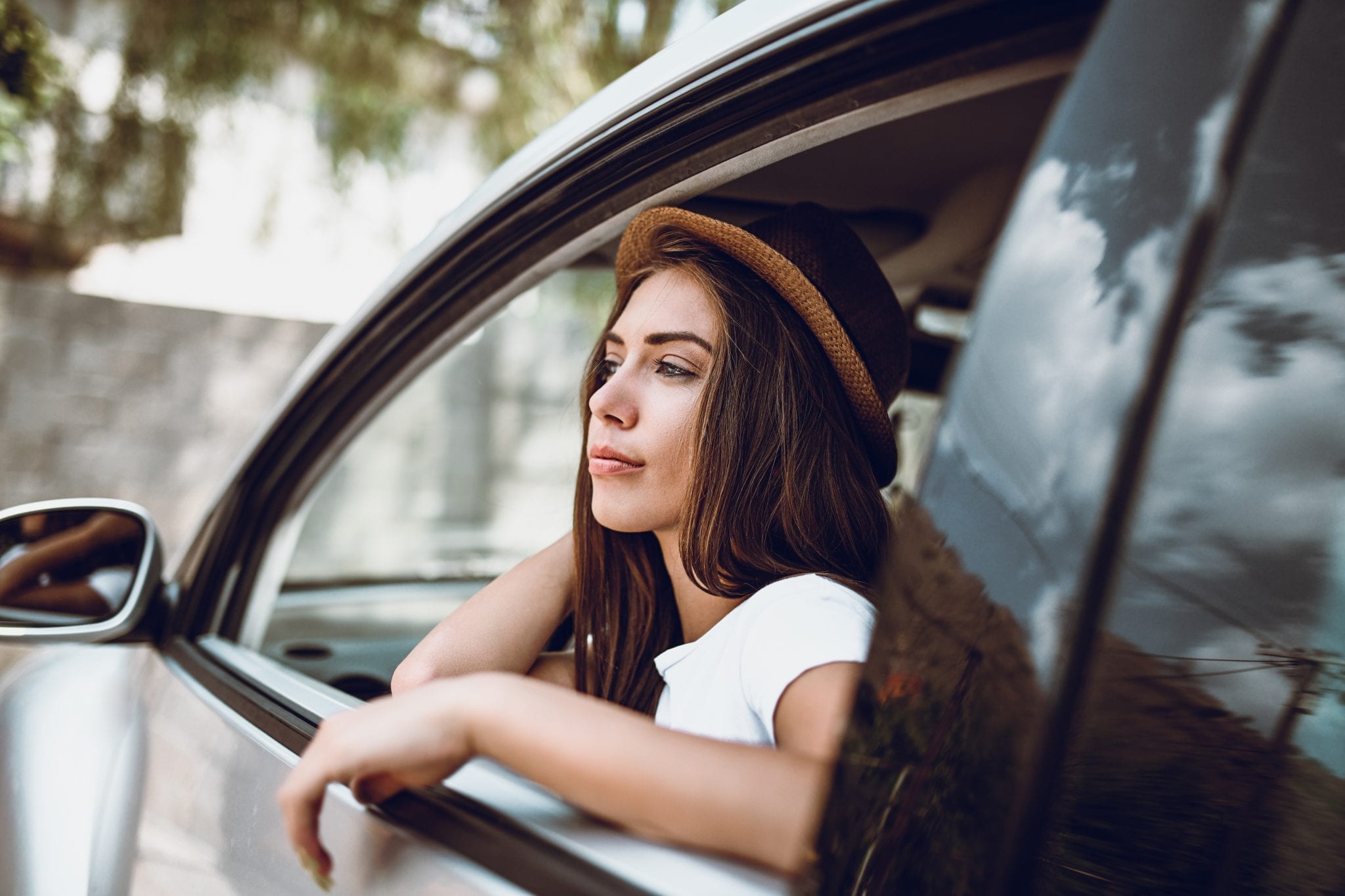Woman looking out of car window