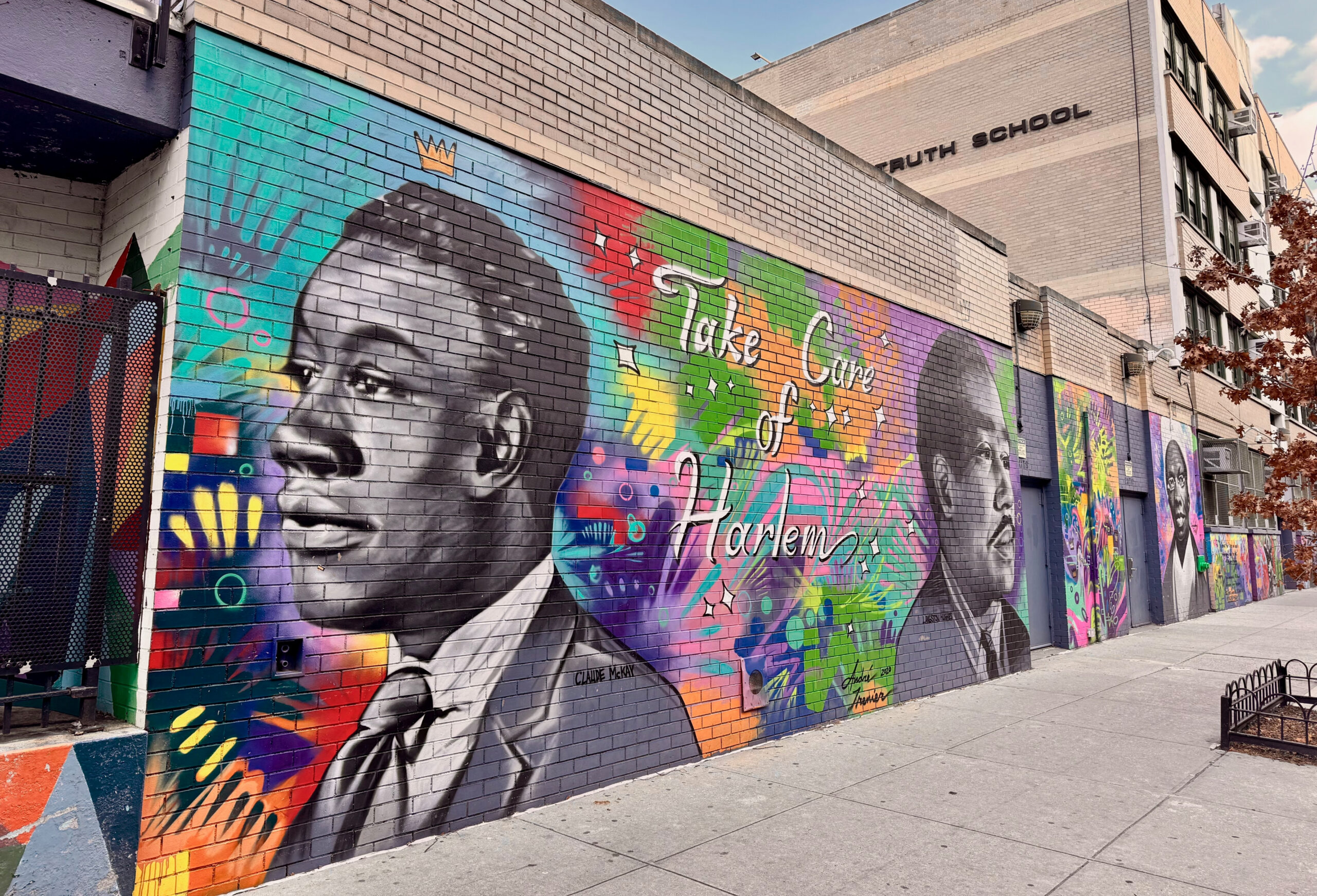 Gemini said A vibrant street mural on a brick wall in Harlem, New York. The mural features large, grayscale portraits of influential Black figures, including the poet Claude McKay