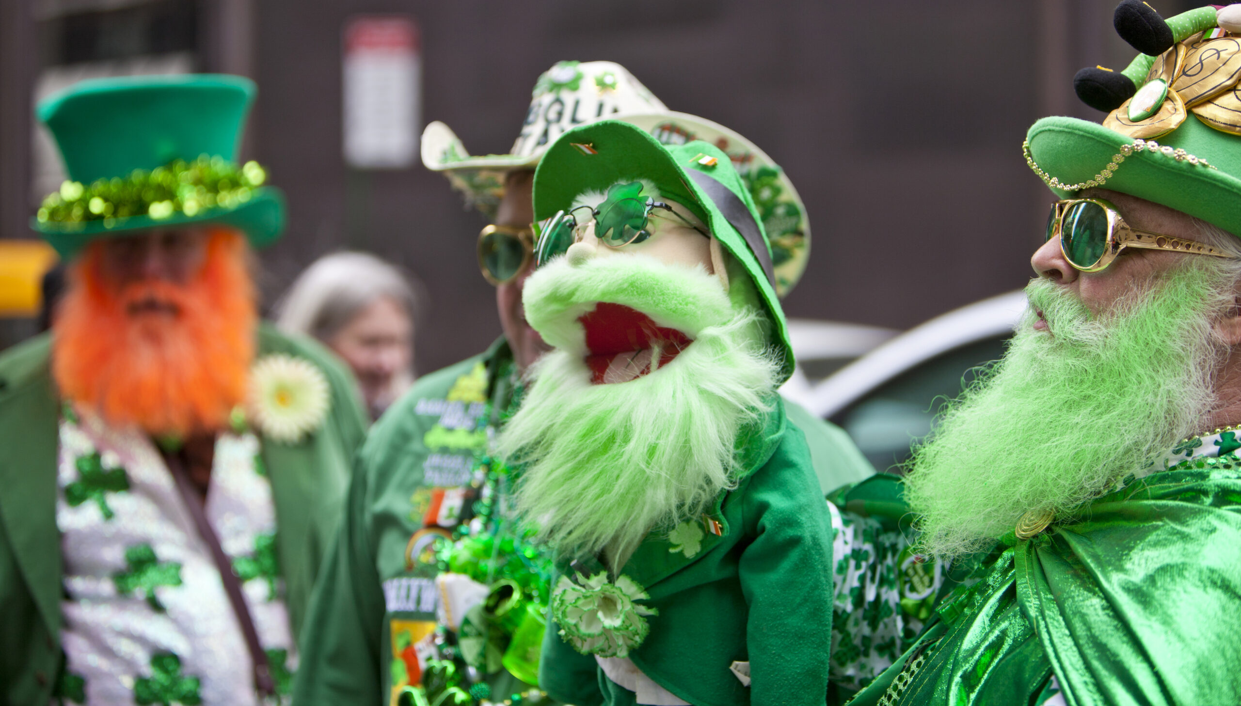 A group of people dressed in festive, elaborate St. Patrick's Day attire
