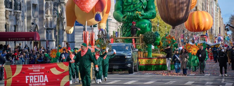 Freida the dog balloon, the Green Giant float, and acorn and pumpkin balloons at the Macy’s Thanksgiving Parade, Central Park West.
