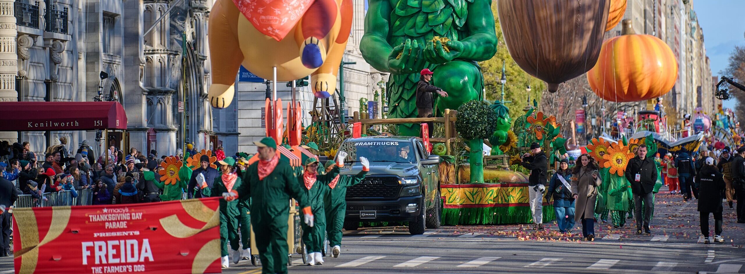 Freida the dog balloon, the Green Giant float, and acorn and pumpkin balloons at the Macy’s Thanksgiving Parade, Central Park West.