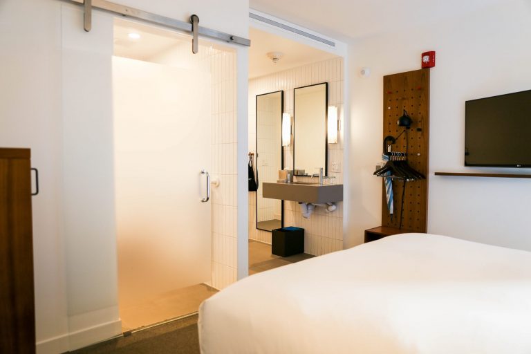 Arlo SoHo Accessible Courtyard Queen hotel room entryway and bed