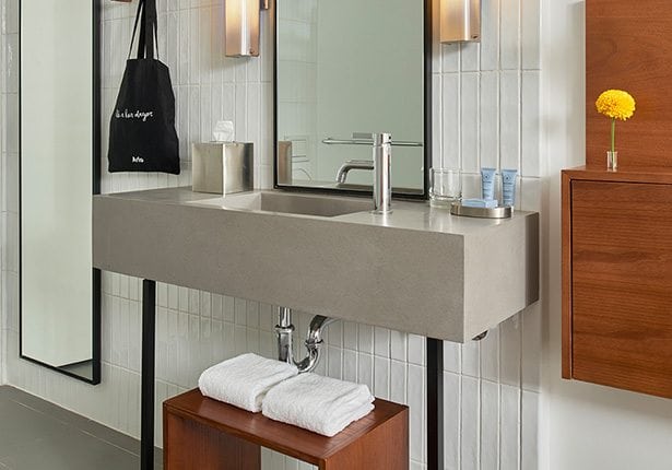 Arlo SoHo Accessible Two Twin hotel room bathroom sink and vanity mirror