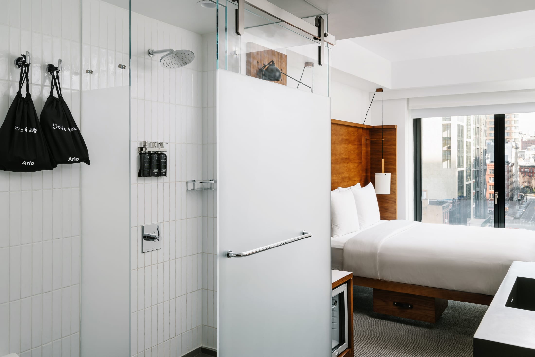 Arlo SoHo City Queen hotel room shower and bed