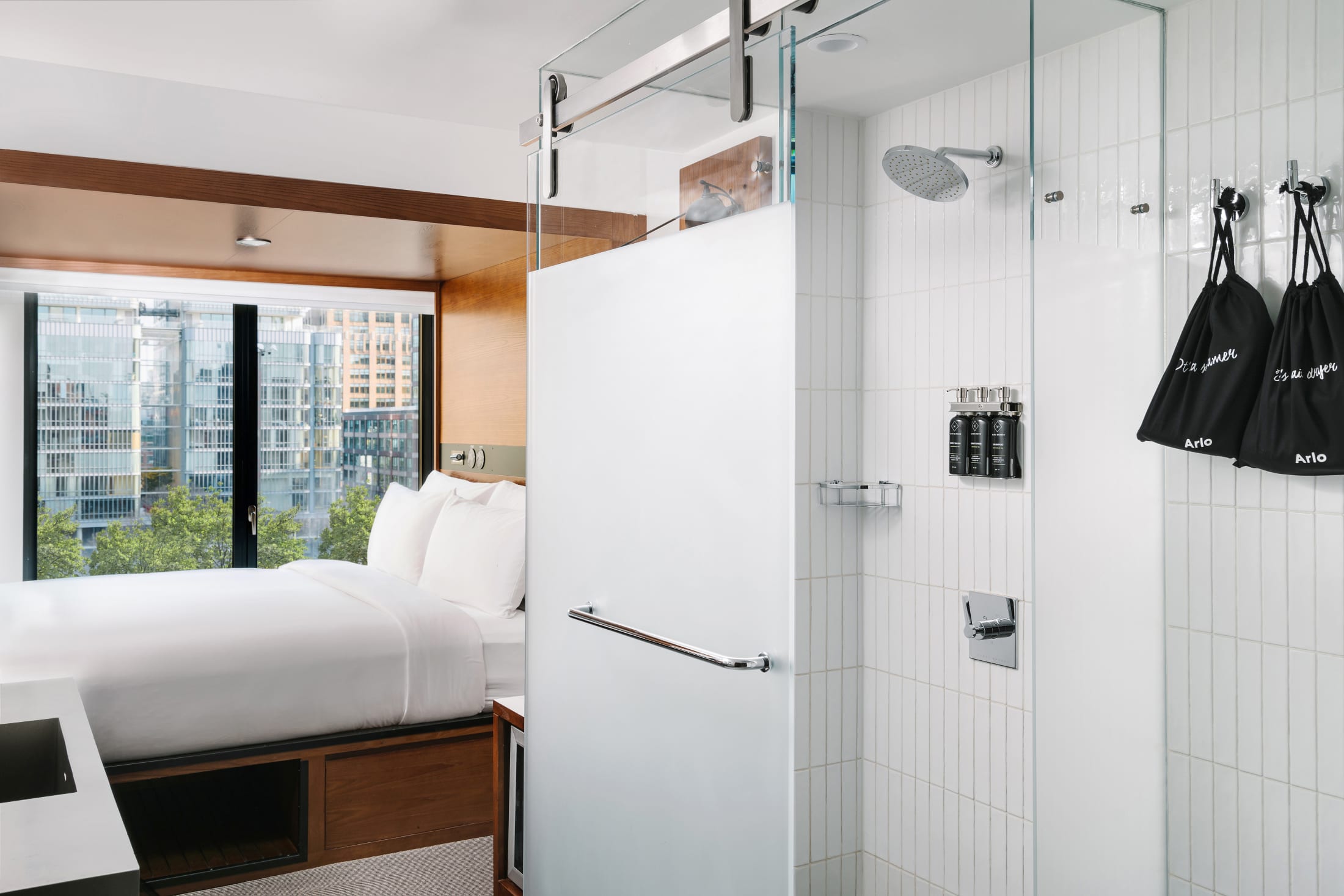 Arlo SoHo City King hotel room shower and bed