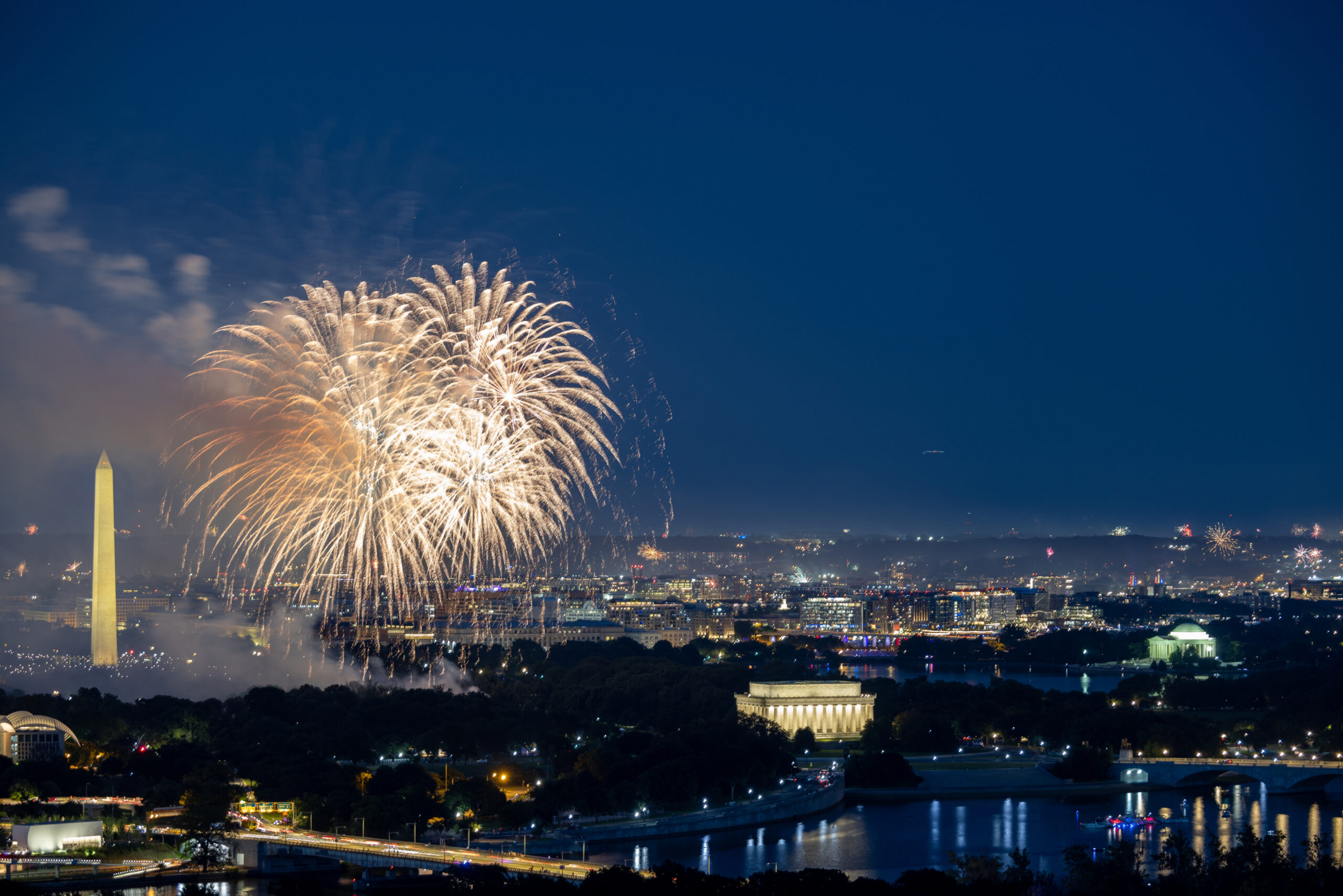 4th of July fireworks over the National Mall in Washington, DC, with the Washington Monument and Lincoln Memorial illuminated during Independence Day celebrations.
