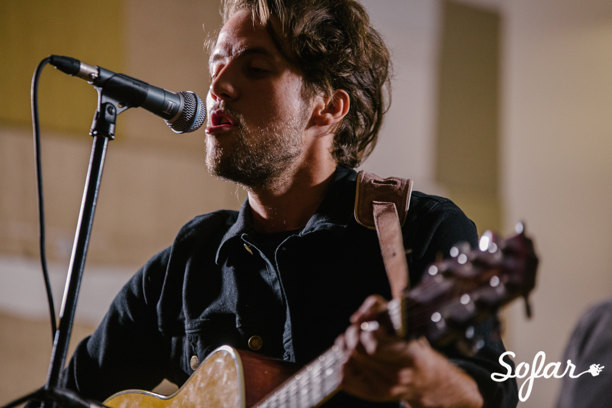 Man singing into a mic Sofar