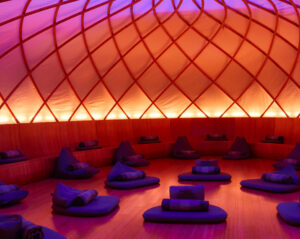 Beautiful meditation studio with blue mats and pillows