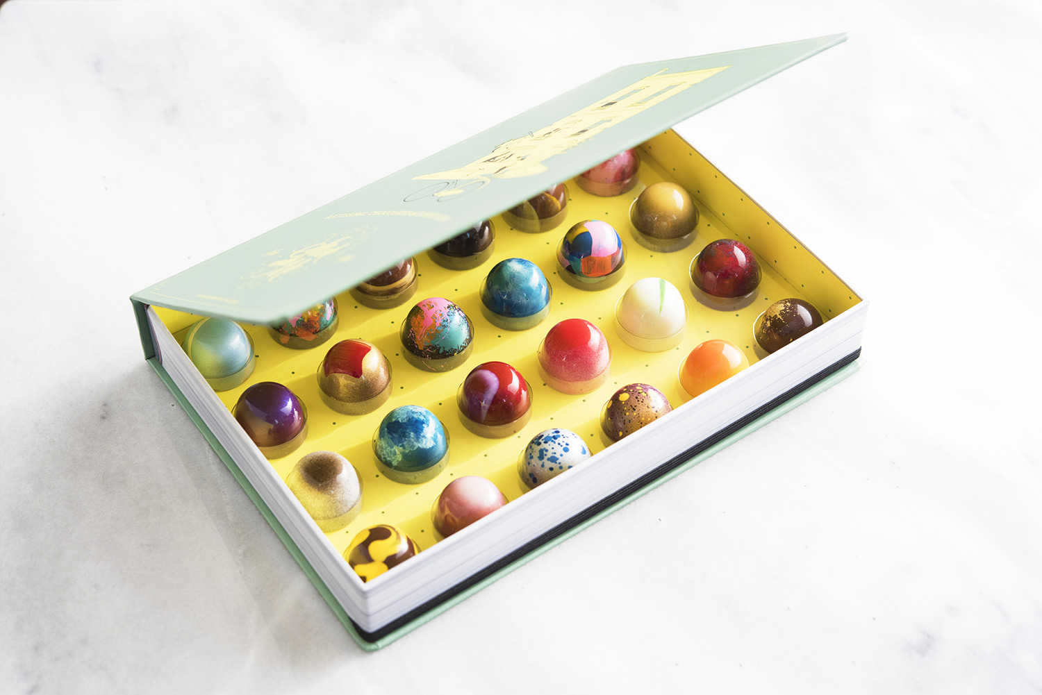 A box of bonbons from Stick With Me, one of NYC's newest and most beautiful chocolate boutiques, specializing in oh-so-mini bonbons.