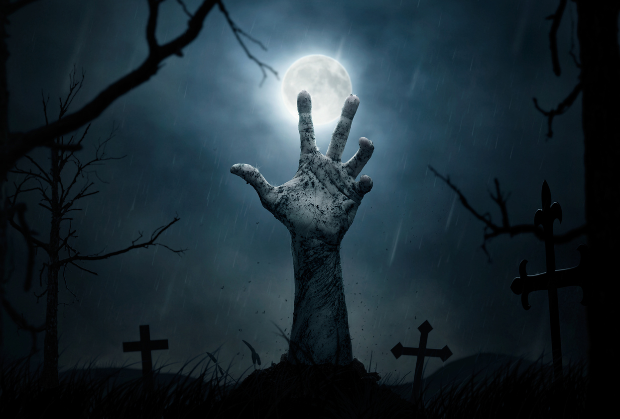 Zombie hand coming out of the grave