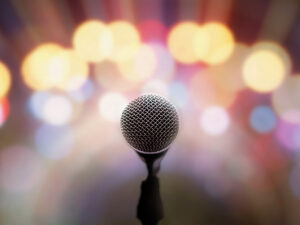 Microphone on stage with blurred bright light background