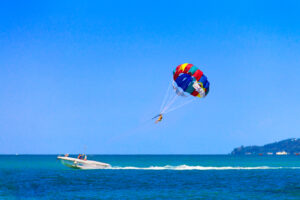 person parasailing one ocean blue waters