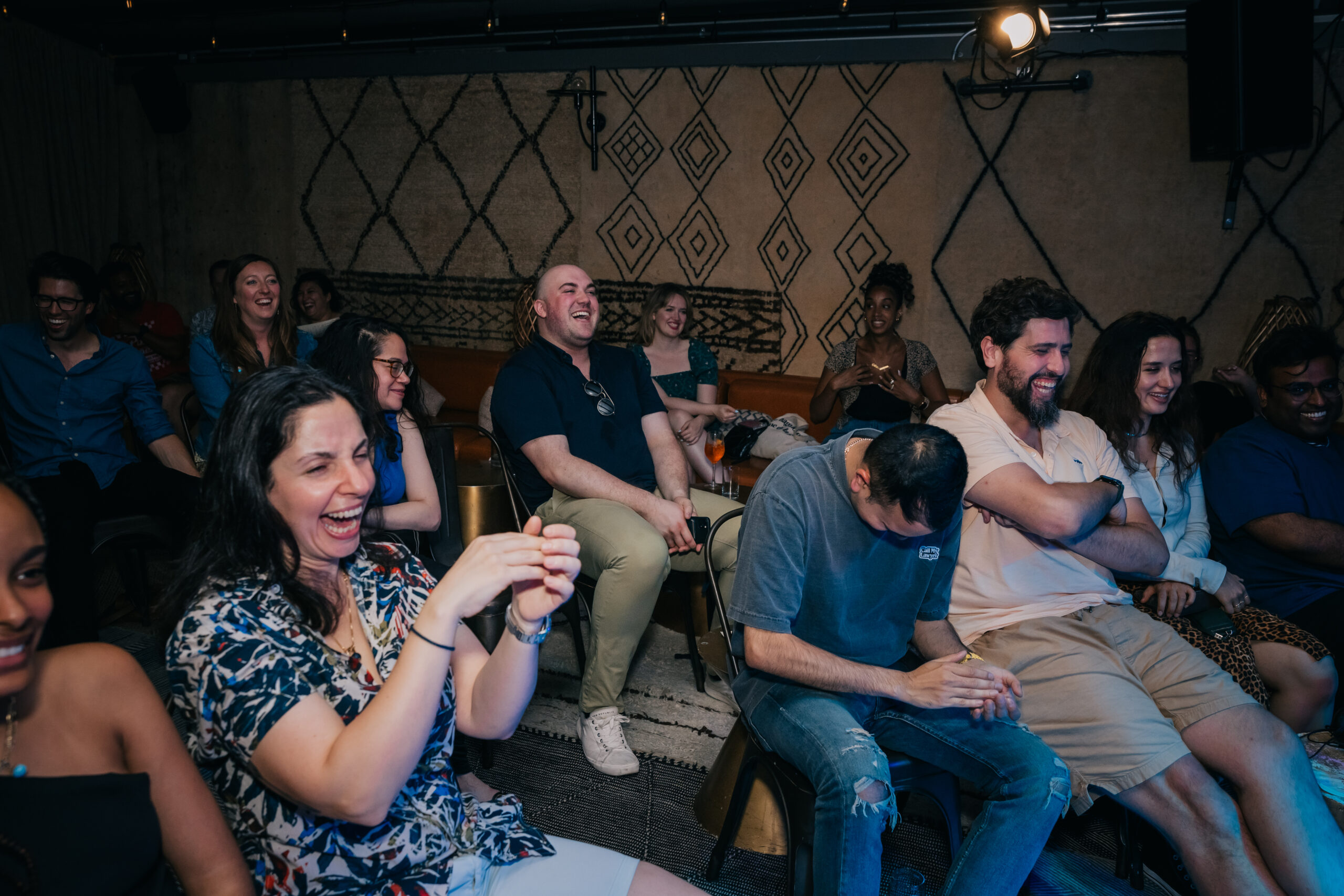 People laughing at a comedy show
