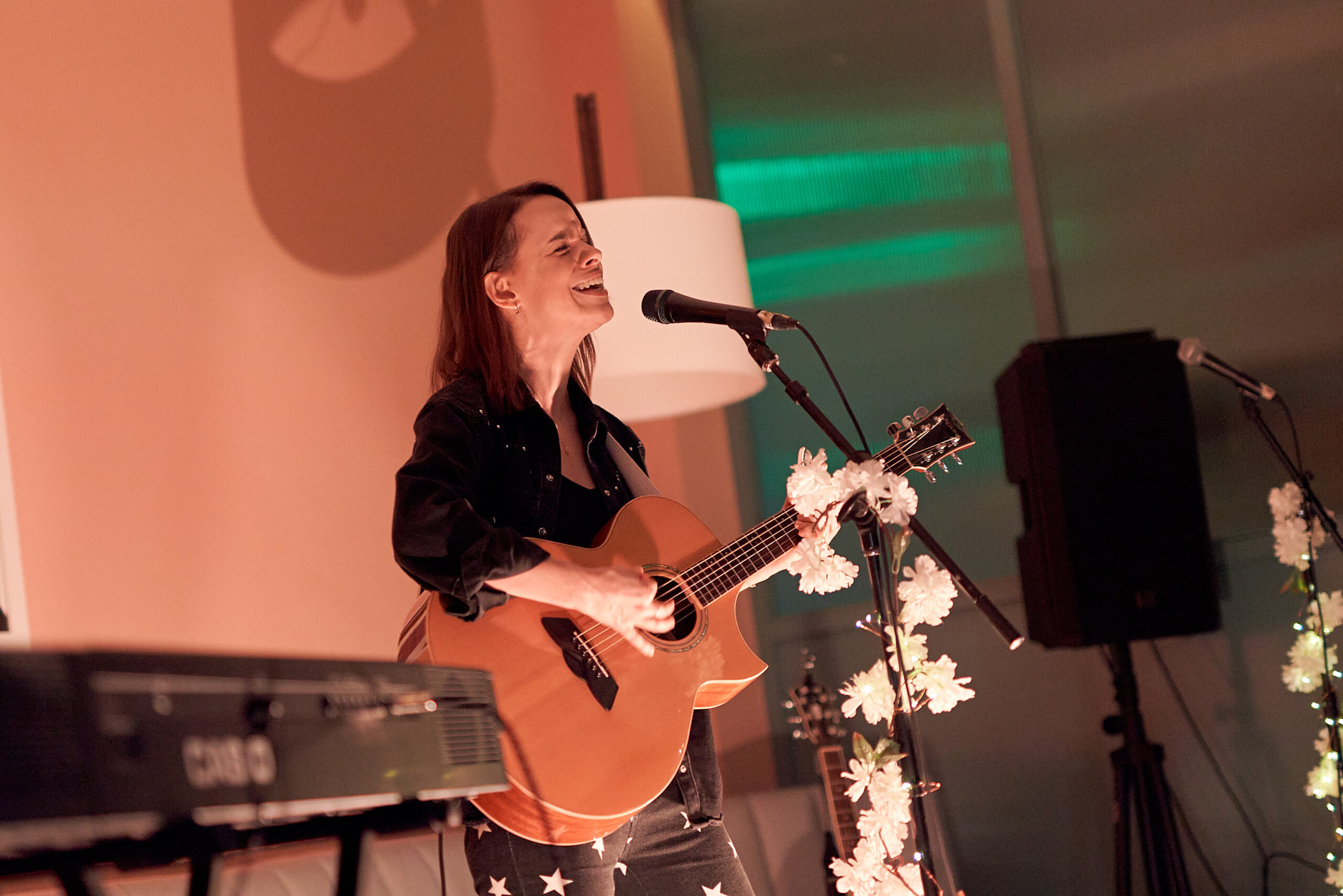 Woman singing and playing guitar