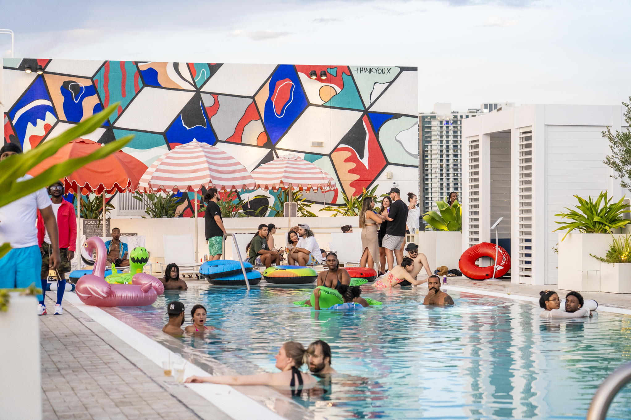 People enjoy a pool party at ART Wynwood