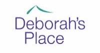 The logo for Deborah’s Place, featuring the name in purple text with a simple green roof-like line above the word “Deborah’s.”.
