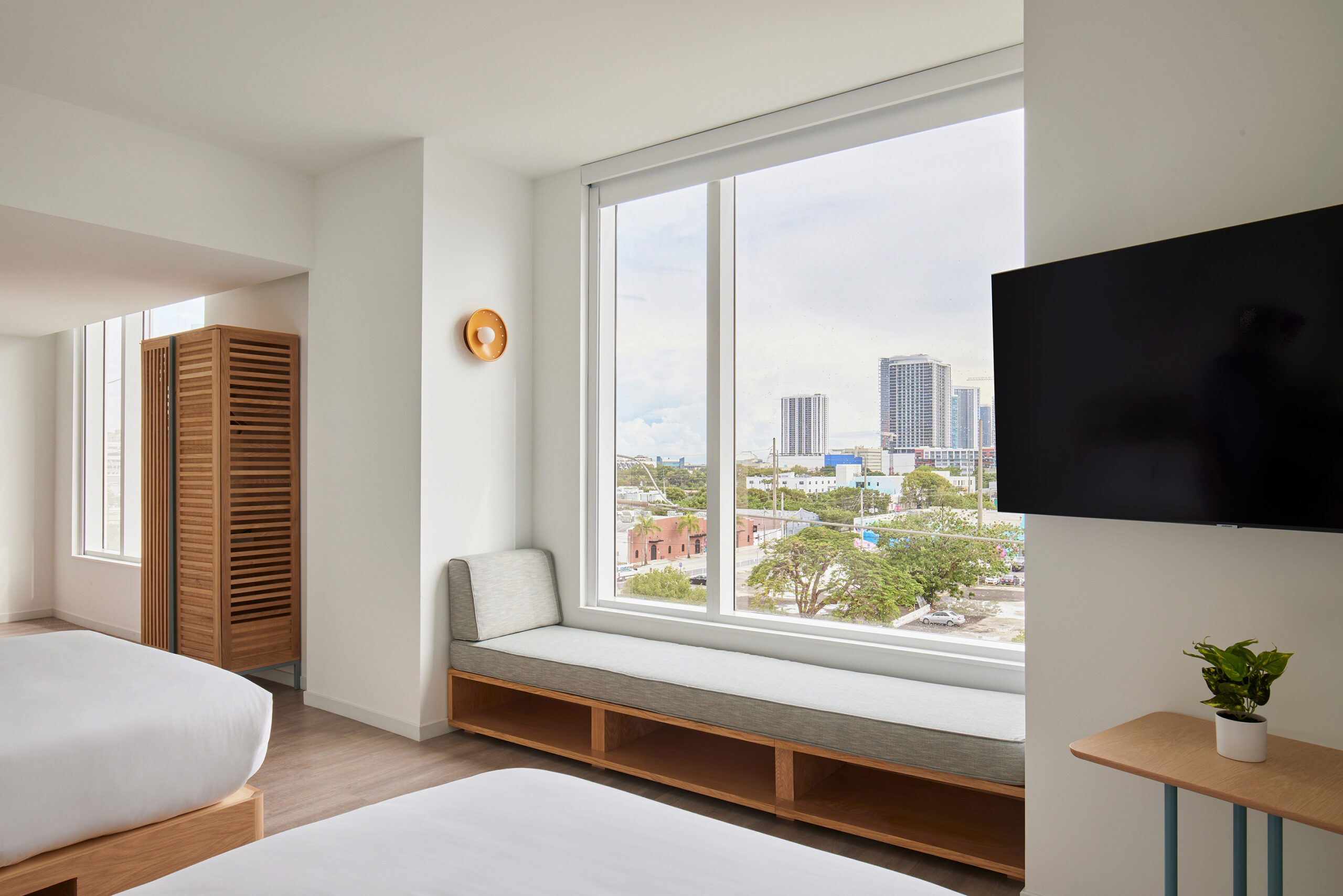 Arlo Wynwood Corner Two Double hotel room window seating and television