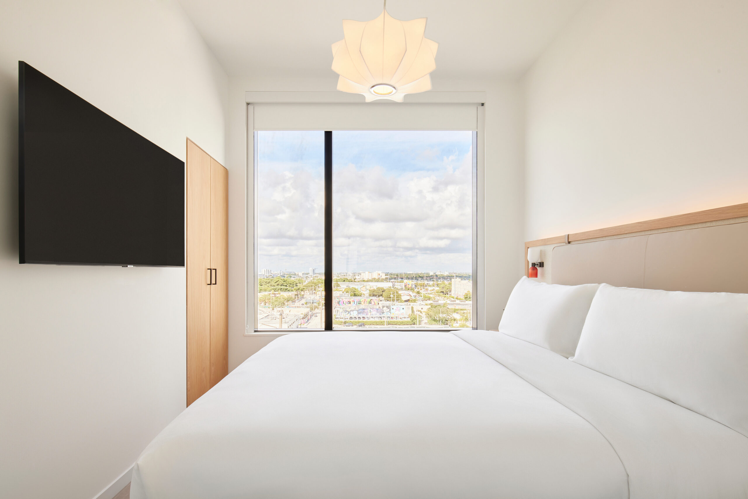 Arlo Wynwood Suite hotel room bedroom with television